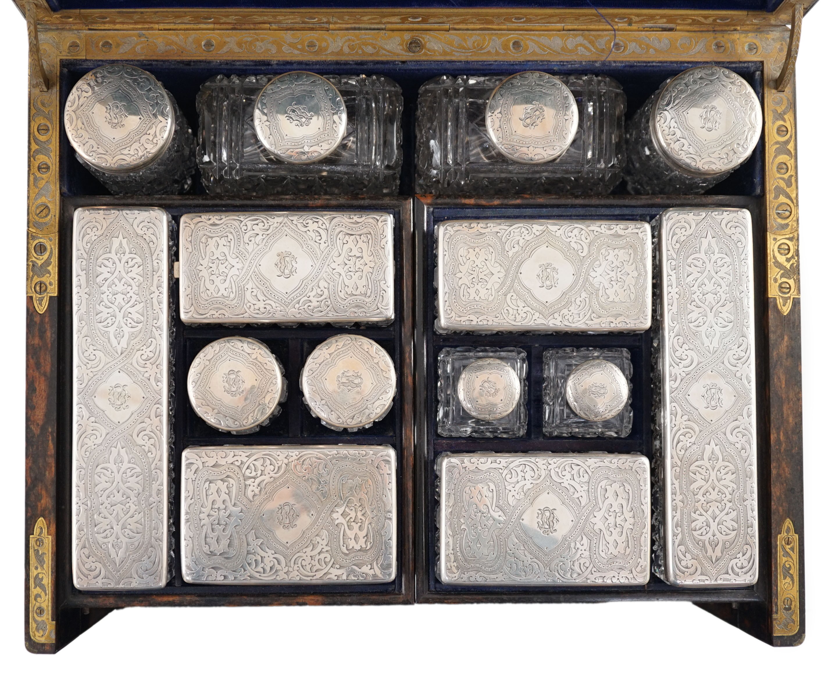 A Victorian brass mounted coromandel wood toilet box, containing fourteen engraved silver mounted toilet jars, by Thomas Whitehouse, London, 1865